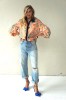 Peach floral shirt with black collar