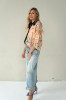 Peach floral shirt with black collar