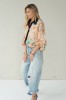 Peach floral shirt with black collar