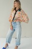 Peach floral shirt with black collar