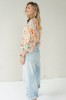 Peach floral shirt with black collar