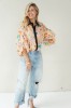 Peach floral shirt with black collar