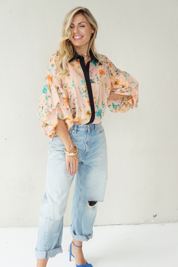 Peach floral shirt with black collar
