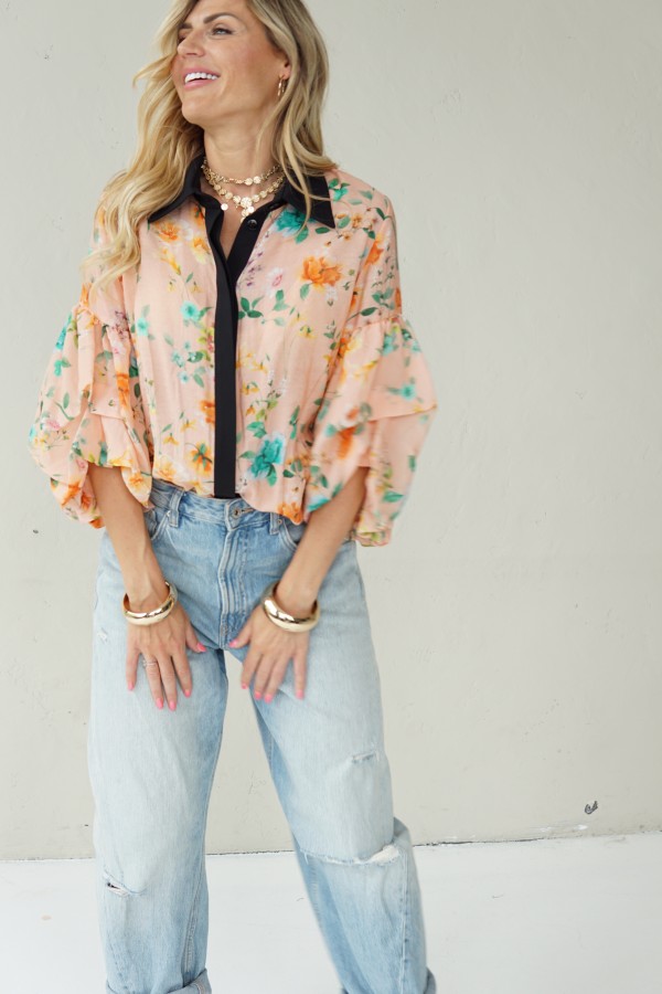 Peach floral shirt with black collar