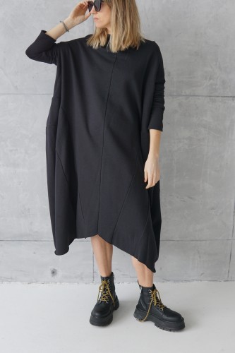 black dress with decorative seams 