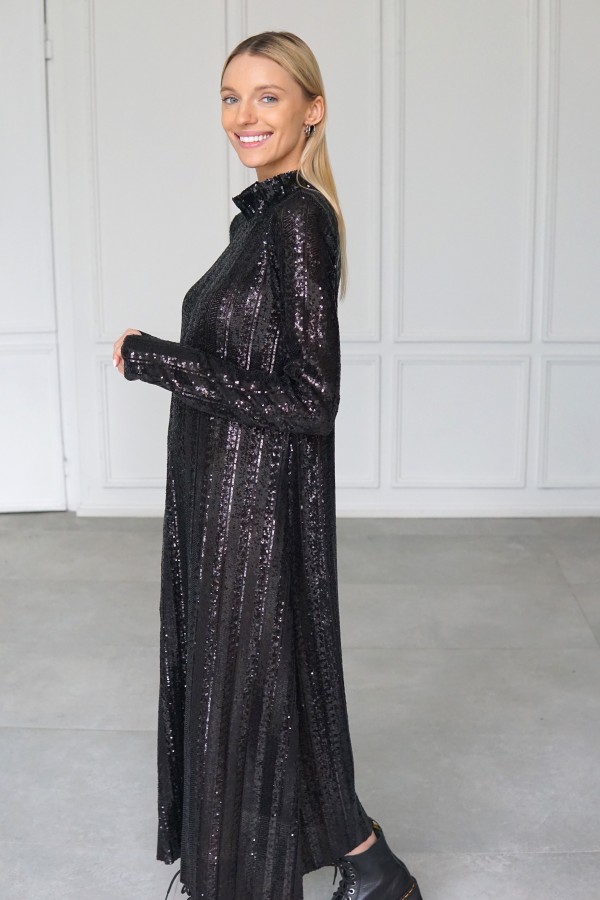 Sparkly evening black dress with long sleeves.