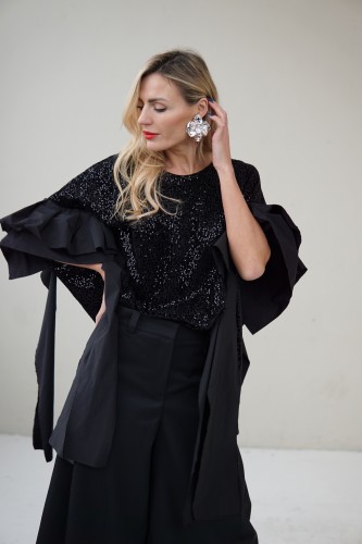 black evening blouse decorated with taffeta ribbons
