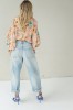 Peach floral shirt with black collar
