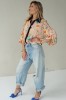 Peach floral shirt with black collar